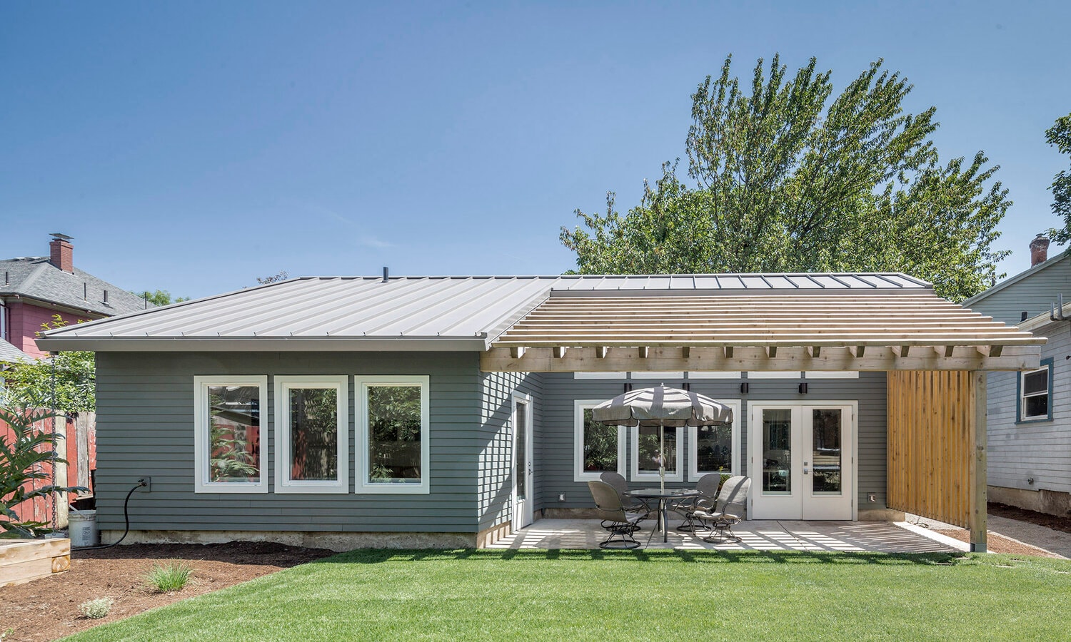 The Screen ADU — modern exterior with metal roof and covered patio